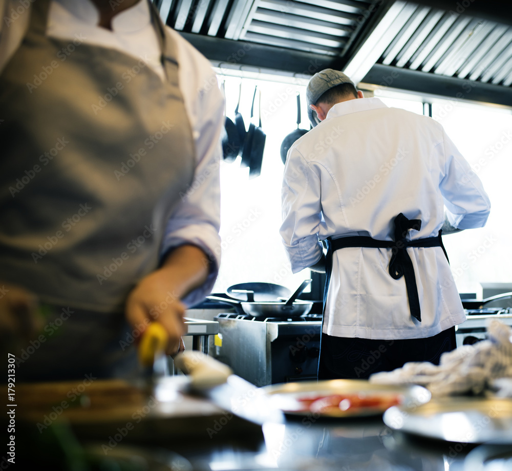 Chef cooking food in the restaurant kitchen