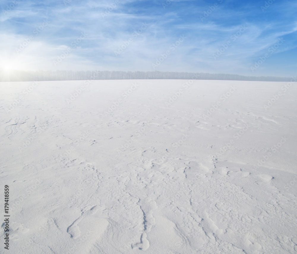  Snowcovered fields on blue sky