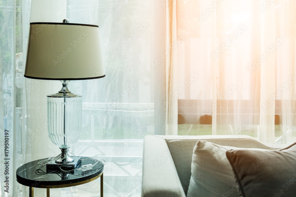  contemporary interior of Living room with part of sofa in sunny day and white curtain interior back