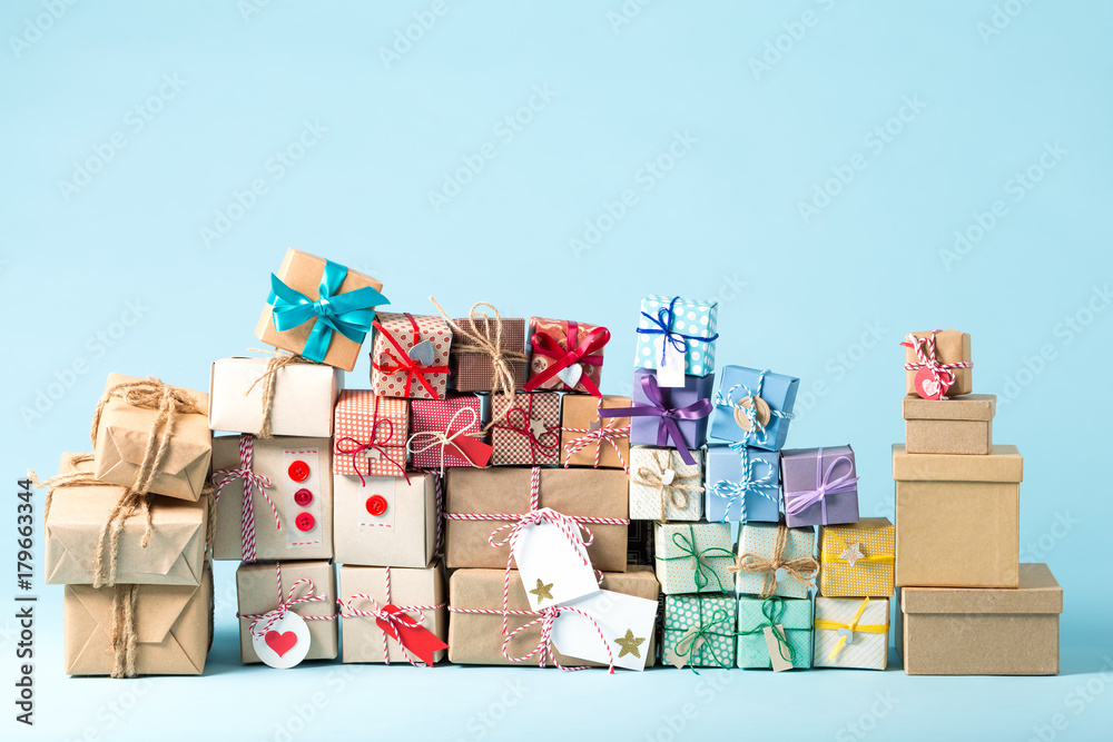 Collection of Christmas present boxes on a light blue background