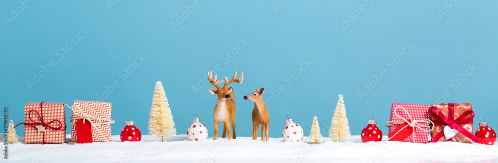 Christmas holiday theme with reindeer and Christmas trees