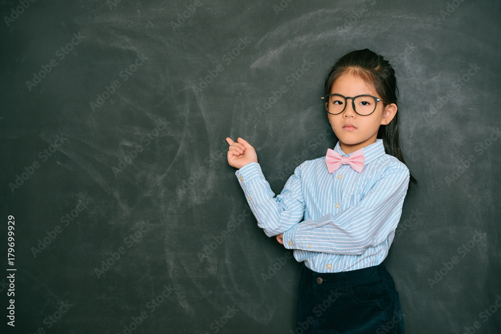 angry pretty little teacher pointing blackboard