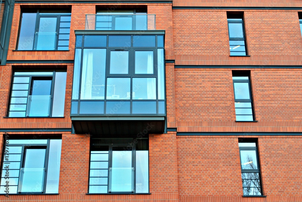 Modern apartment buildings on a sunny day with a blue sky. Facade of a modern apartment building