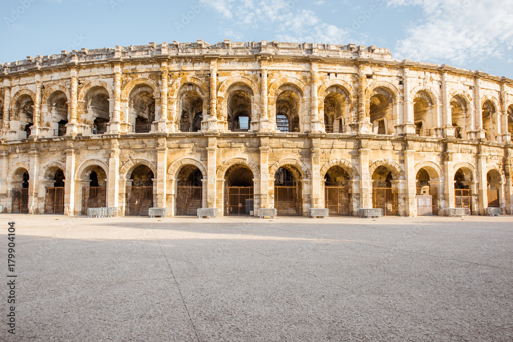 Morning view on the ancient Roman amphitheatre in Nimes city in the Occitanie region of southern Fra