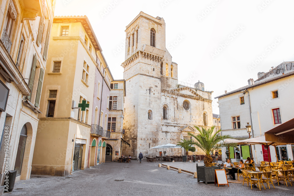 View on the saint Castor cathedral in the center of the old town of Nimes city in the Occitanie regi