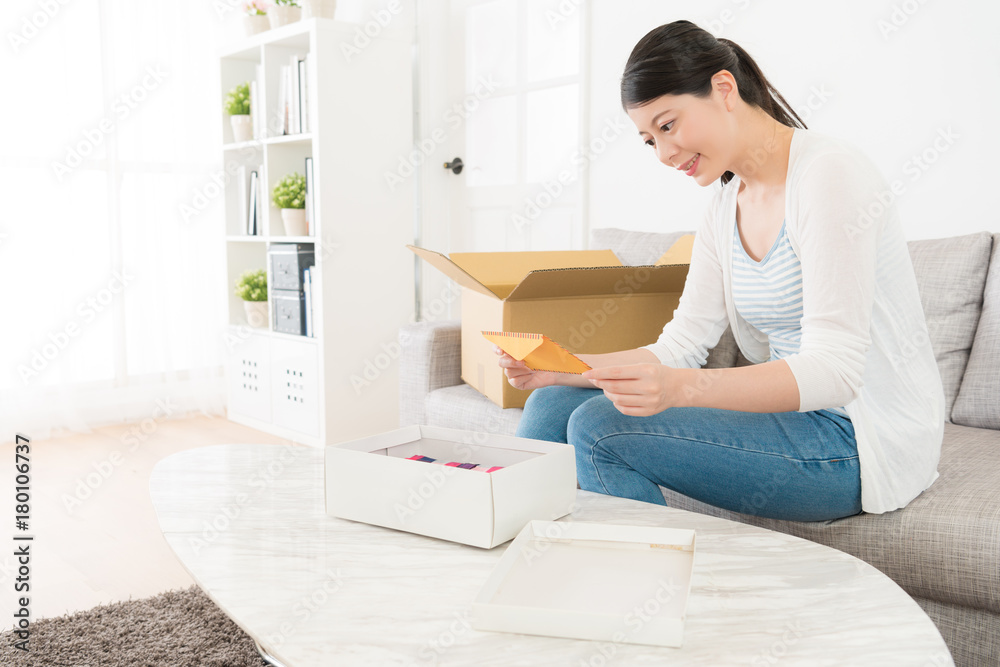 smiling elegant woman received present with letter