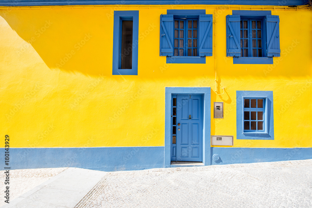 Beautiful yellow building facade in the old town of Aveiro city in Portugal