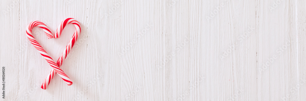 Christmas candy cane white wooden textured background