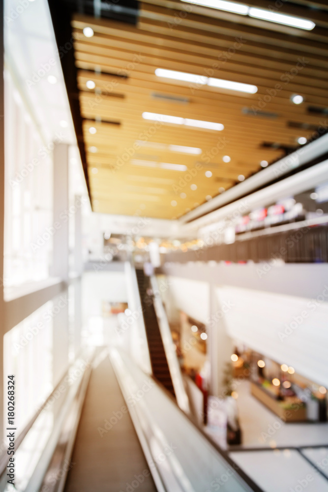 blur image background of supermarket mall with escalator