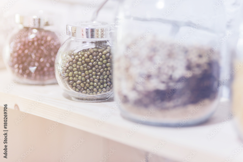 glass bottle of nature seed in white kitchen