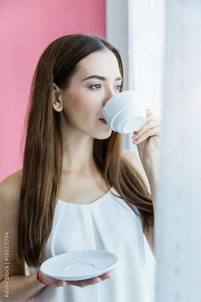 beautiful happiness caucasian girl enjoy morning moment with hot coffee in white tshirt with light f