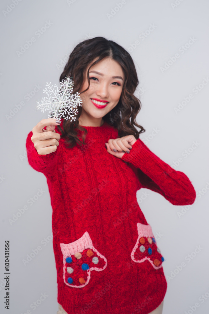 Portrait of a beautiful  young asian woman in warm clothes