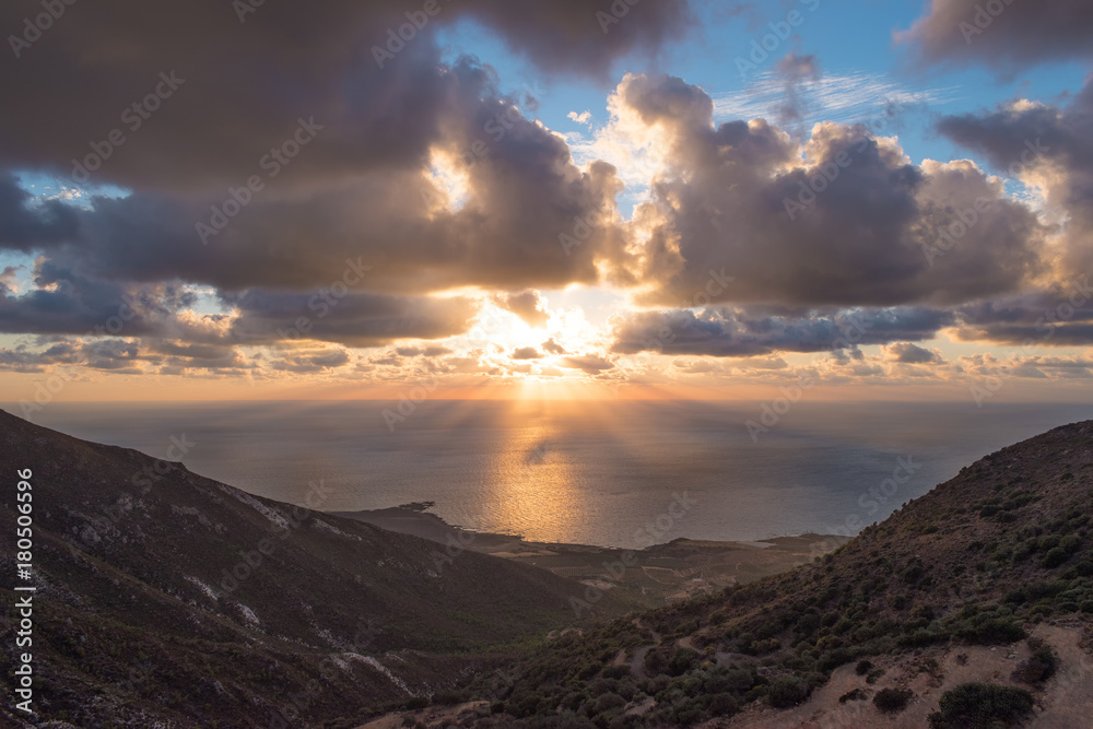 Beautiful colorful sunset at the sea with dramatic clouds and sun shining. Beauty world natural outd