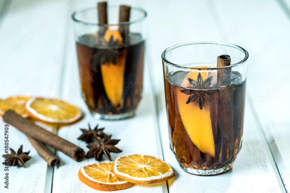 The Mulled wine on white table in night celebration of  New Year party and delicious Christmas drink