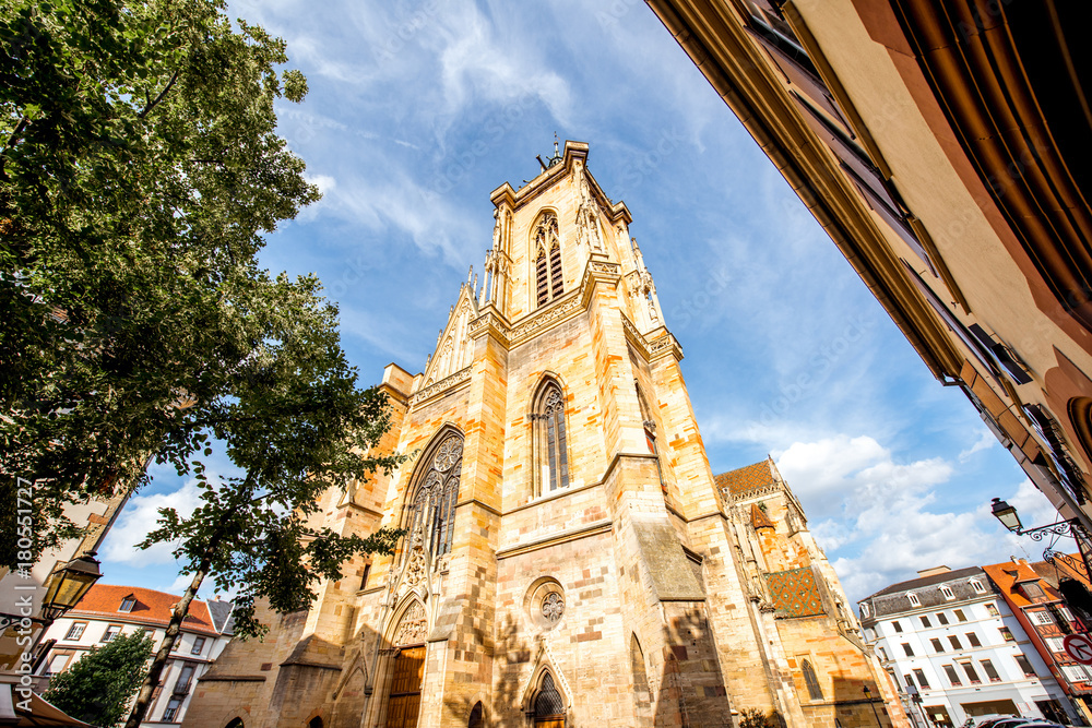 View on the saint Martins cathedral in the center of Colmar town during the sunny weather in Alsace 