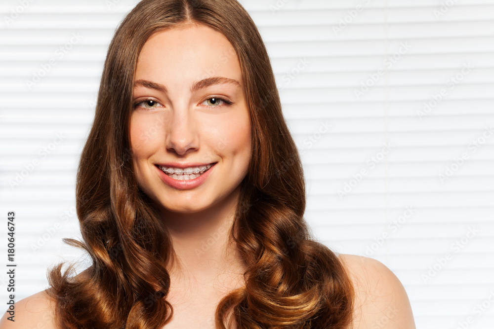 Beautiful brunette woman with dental braces