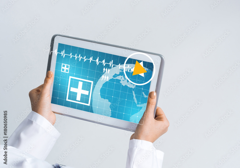 Close of female doctor hands working with tablet pc computer