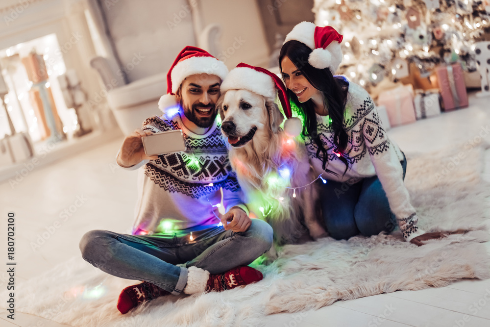 Couple with dog on New Years Eve