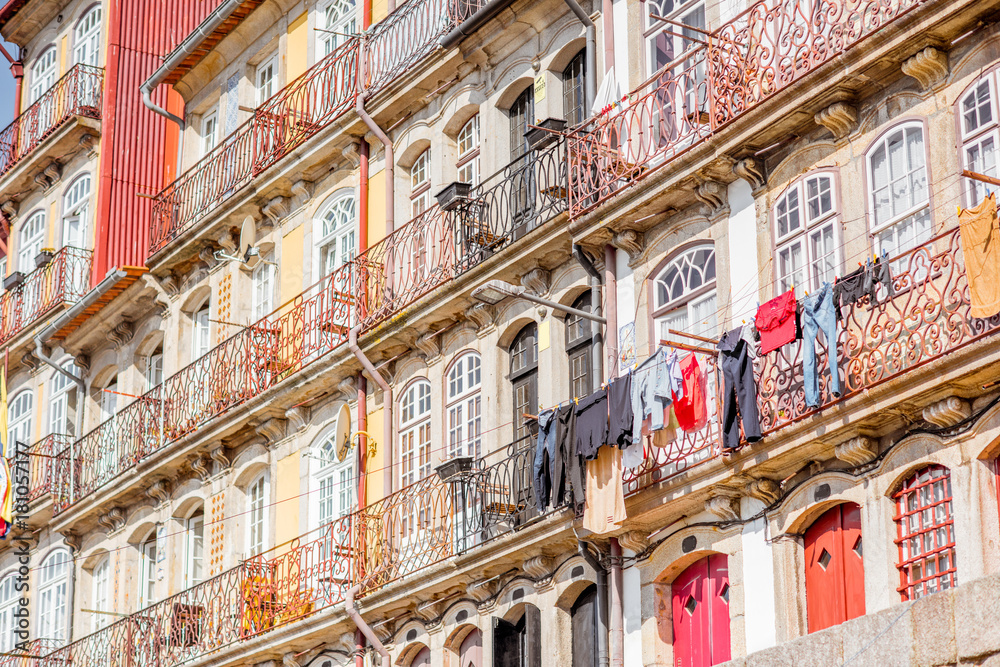 Street view on the beautiful old buildings with portuguese tiles on the facades in Porto city, Portu