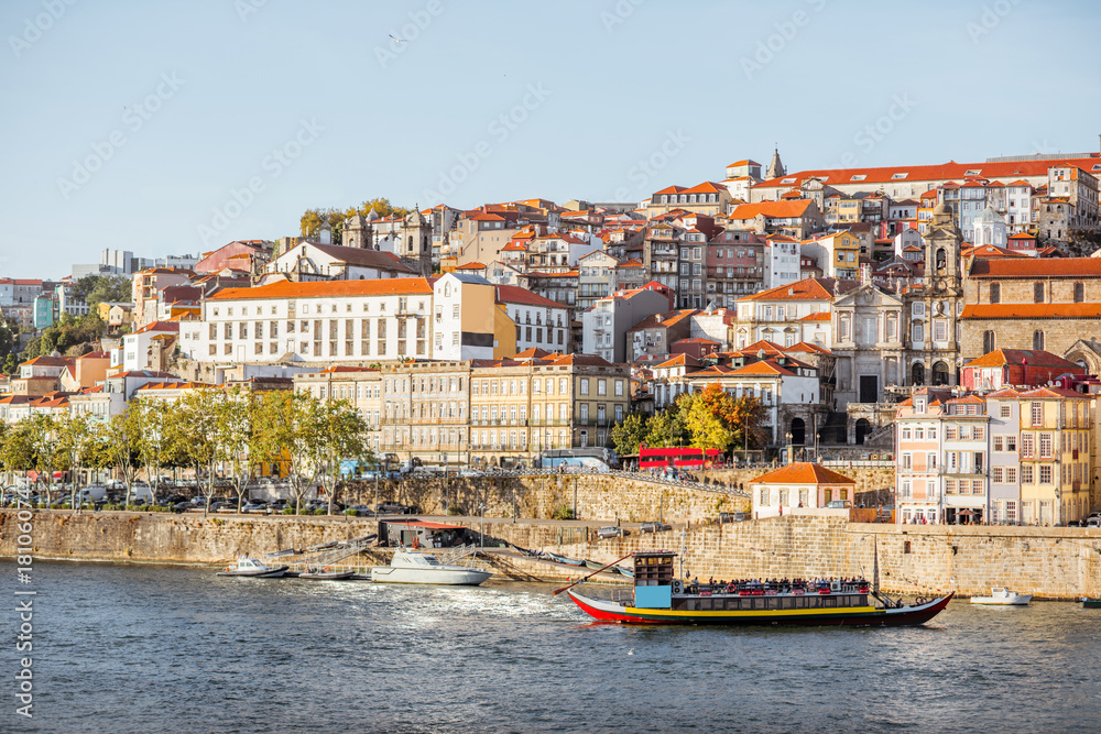 Landscape view on the old town on the riverside of Douro river in Porto during the sunset in Portuga