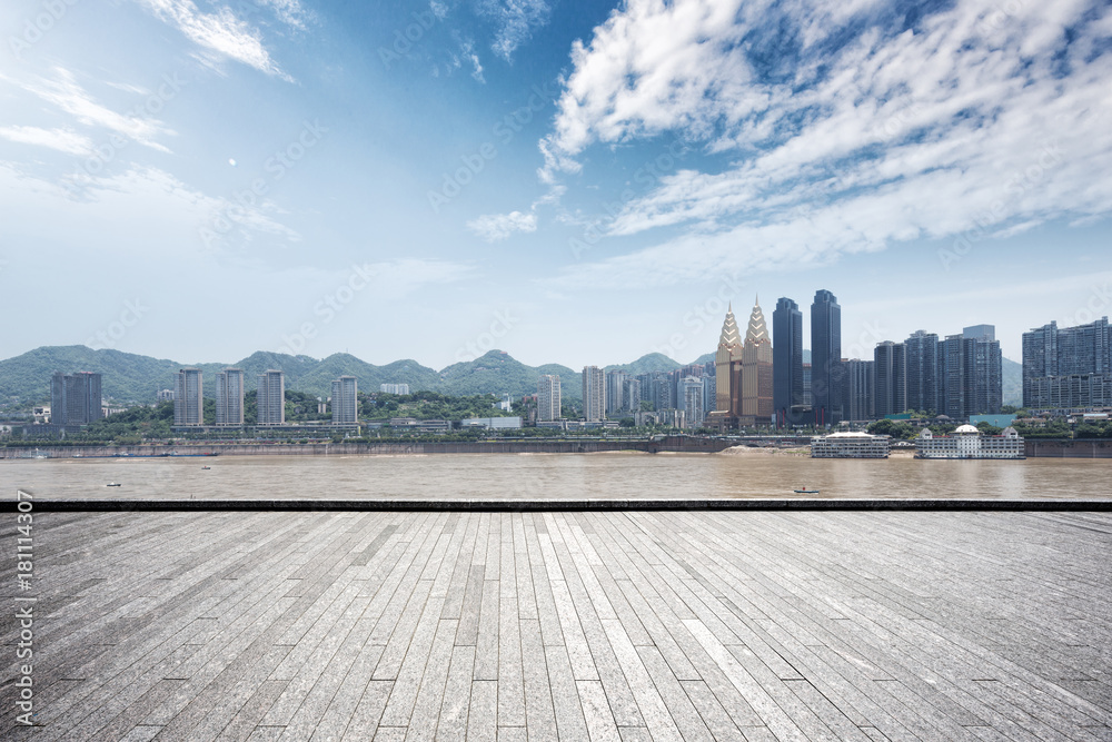 empty brick floor with modern cityscape