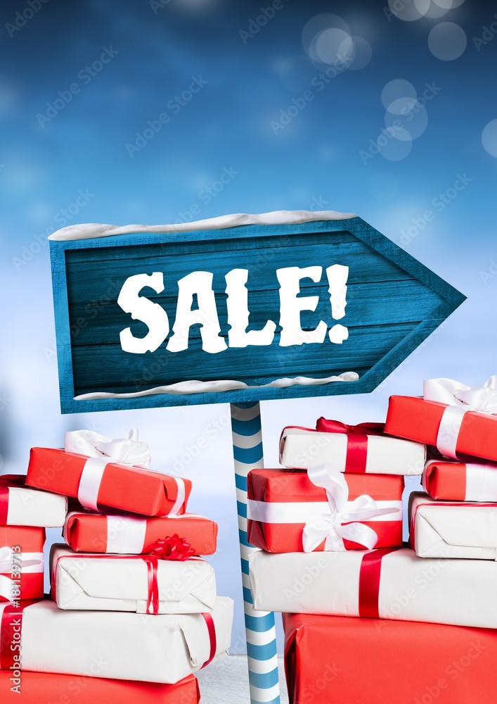 Sale text and gifts with Wooden signpost in Christmas Winter