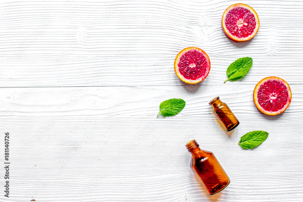 organic cosmetic with citrus on wooden background top view