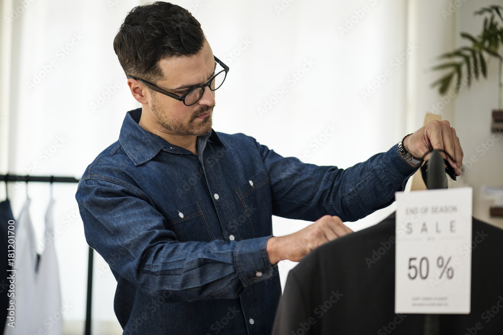 Man working in retail cloth shop