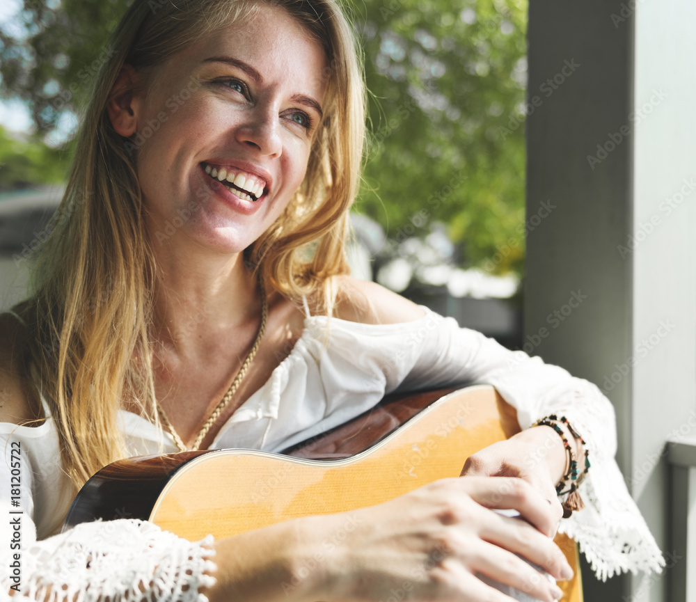 Beautiful singer songwriter with her guitar