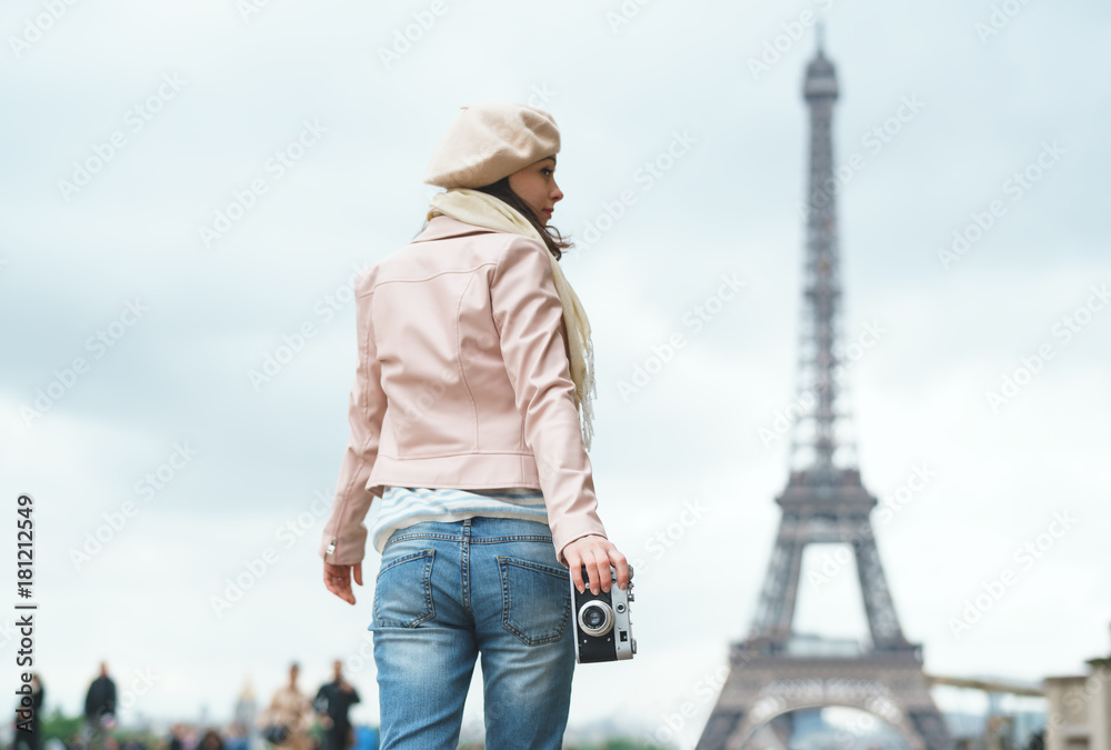 Young girl with a retro camera