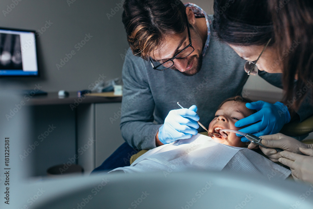 Little boy getting dental treatment