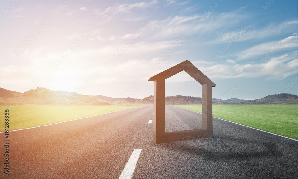 Conceptual background image of concrete home sign on asphalt road