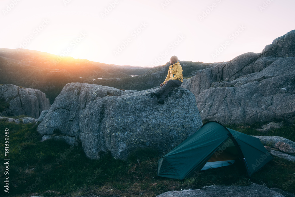 Alone tourist near his tent