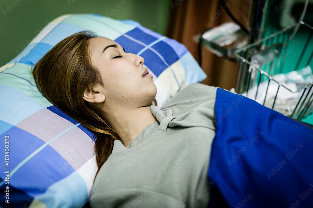 health hospital concept with sick woman with Closeup saline water line on a hand of patient and infu