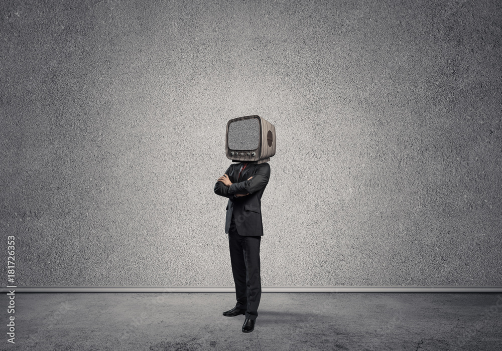 Businessman with an old TV instead of head.