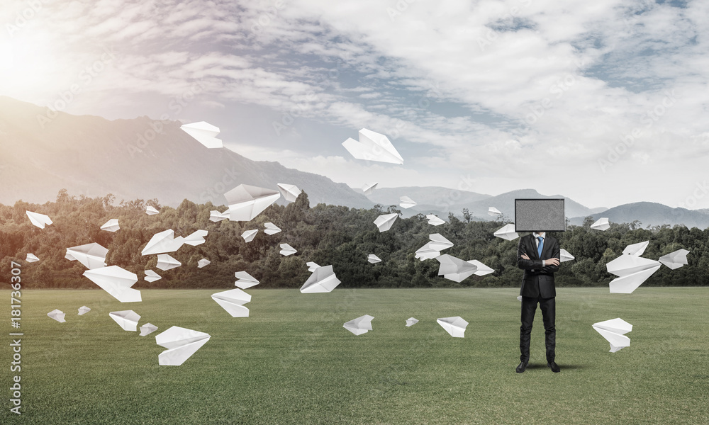 Businessman with TV instead of head.