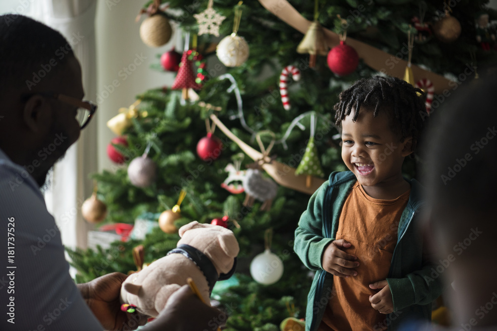 Happy little kid receiving a Christmas present