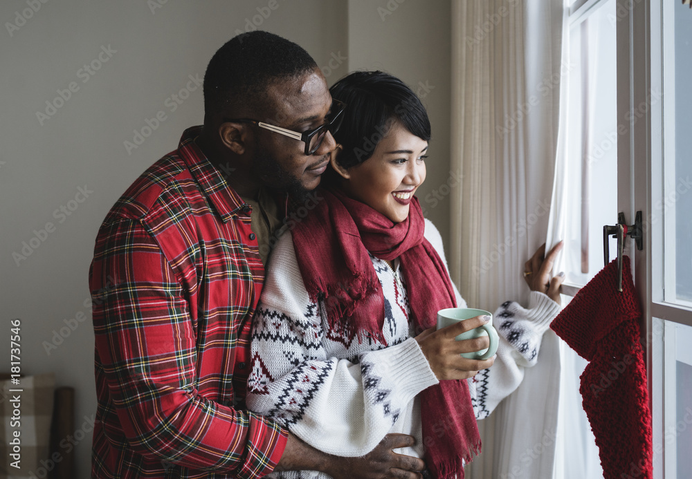 A cheerful couple enjoying Christmas holiday