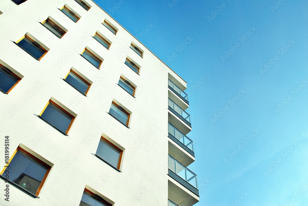 Modern apartment buildings on a sunny day with a blue sky. Facade of a modern apartment building