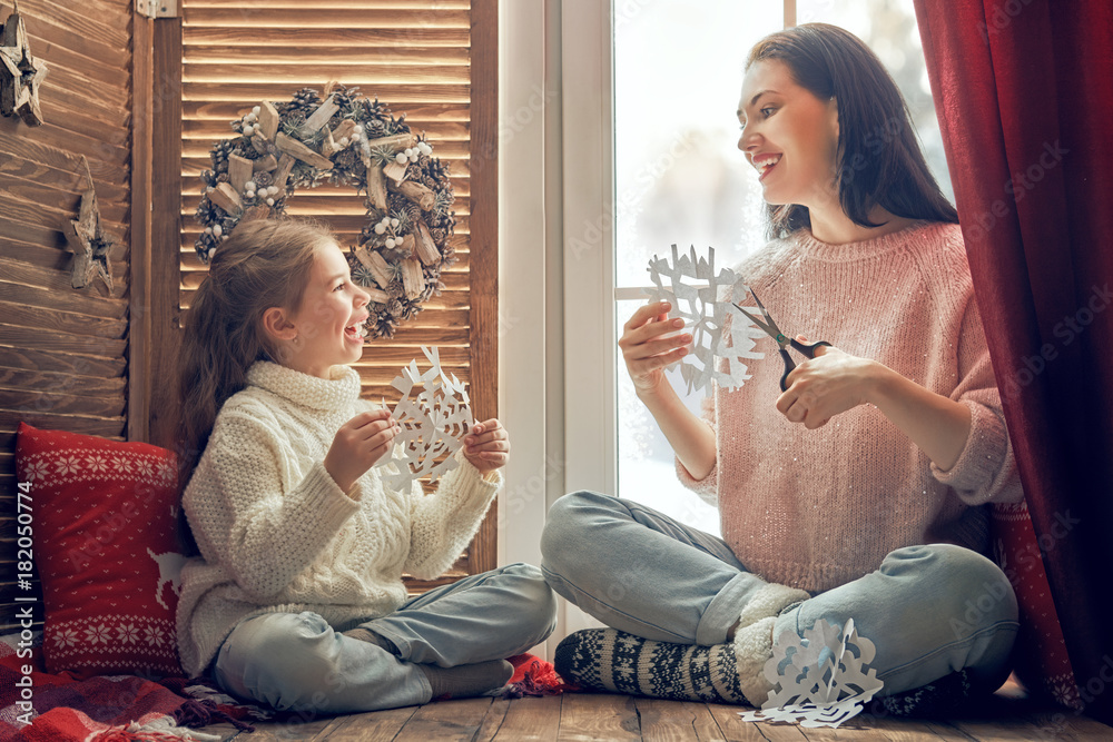 family sitting by the window