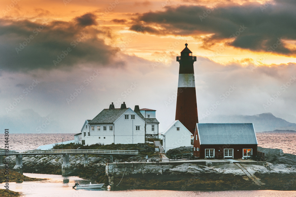 Norway Landscape Tranoy Lighthouse at sunset sea and mountains on background Travel scenery natural 