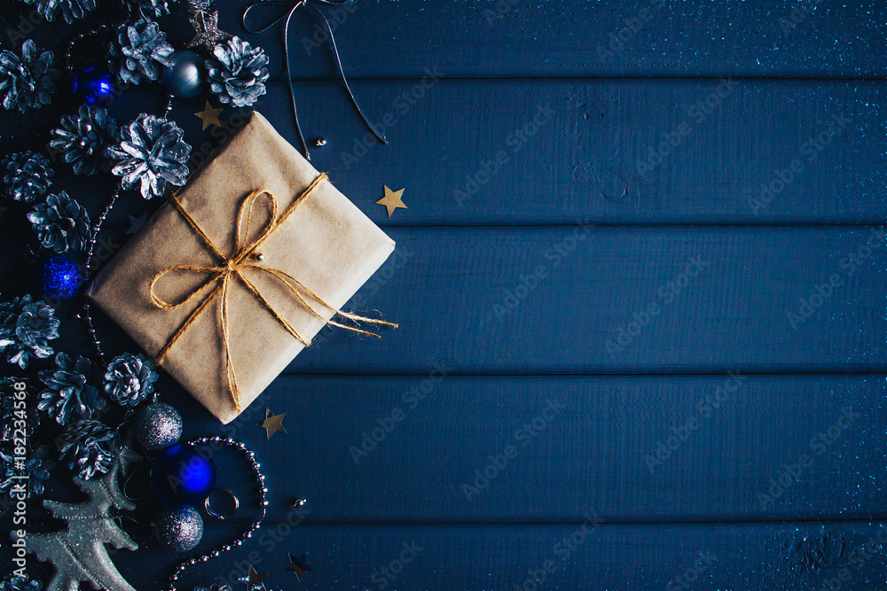 blue christmas background with gift and cones