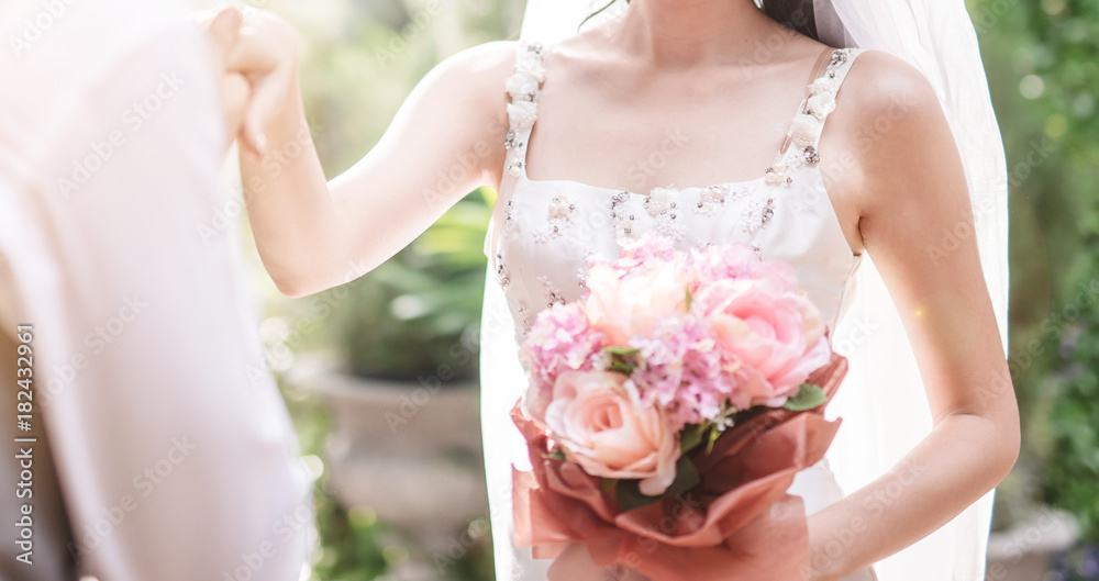 Groom kissing hand of his lovely bride.wedding outdoor