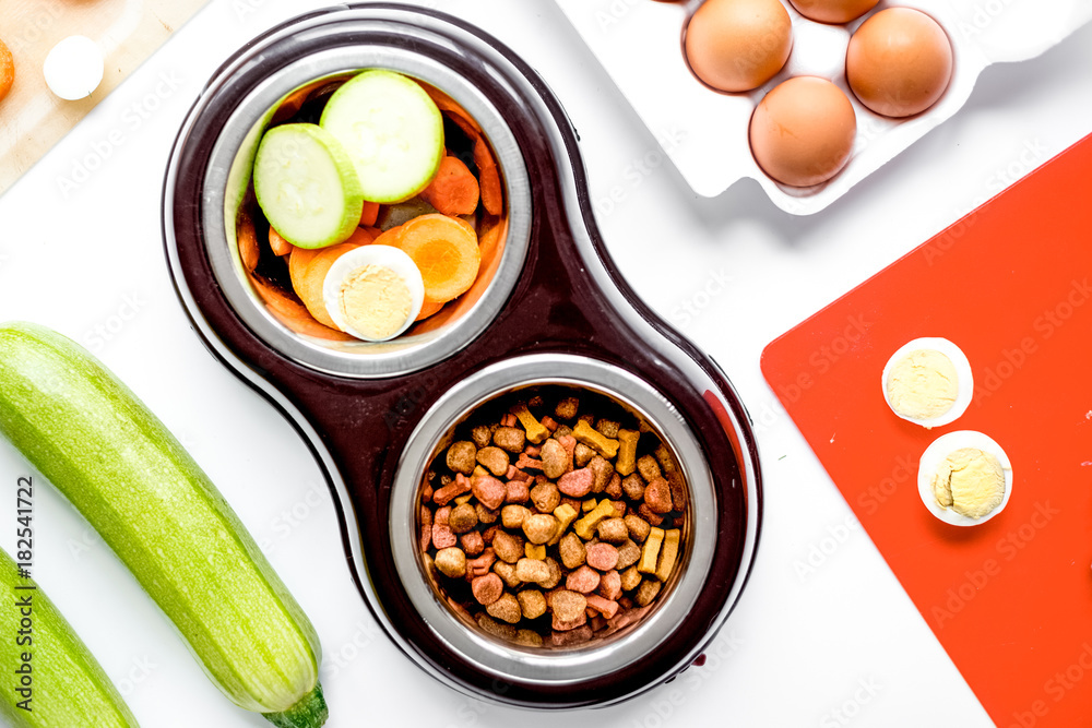 petfood set with vegetables and eggs on kitchen table background