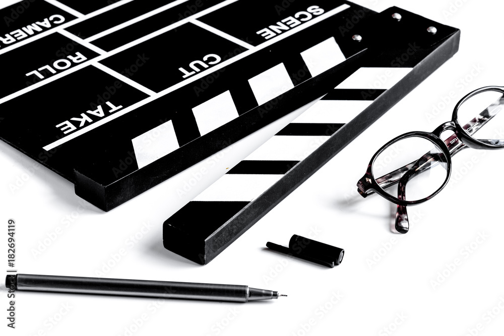 Screenwriter desktop with movie clapper board white background