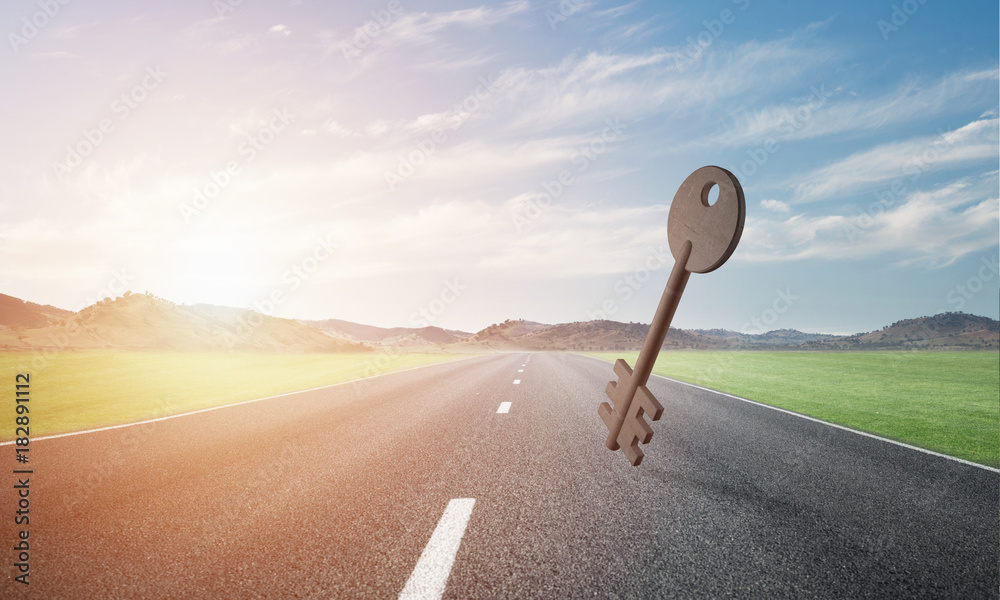 Conceptual background image of concrete key sign on asphalt road