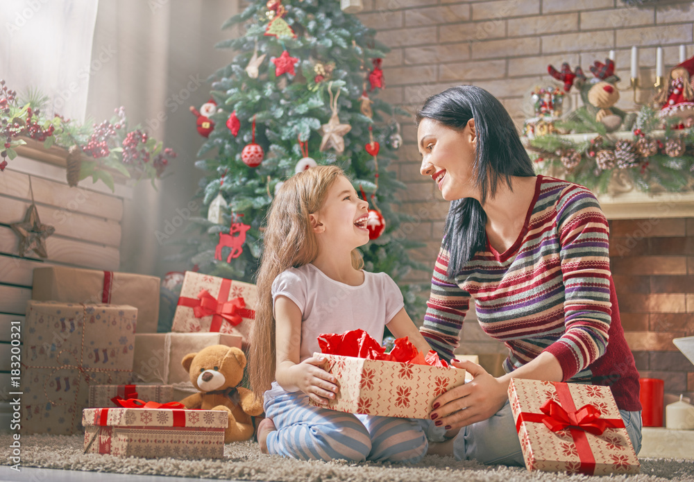 Mother and daughter exchanging gifts