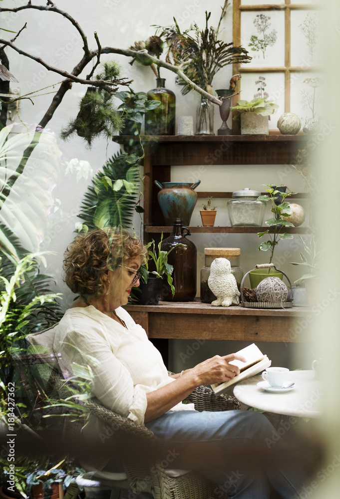 Woman relaxing while reading a book<br />