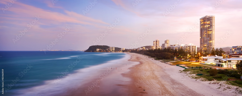 Dusk over North Burleigh Heads on the Gold Coast with the Burleigh headland visible in the distance.