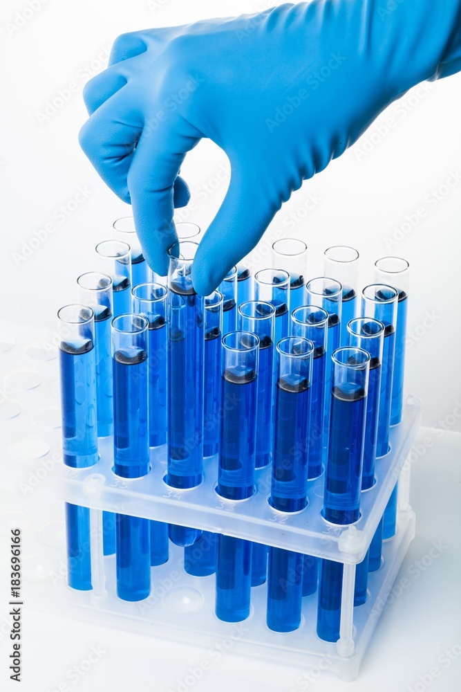 Hand Holding Test Tube with Liquid